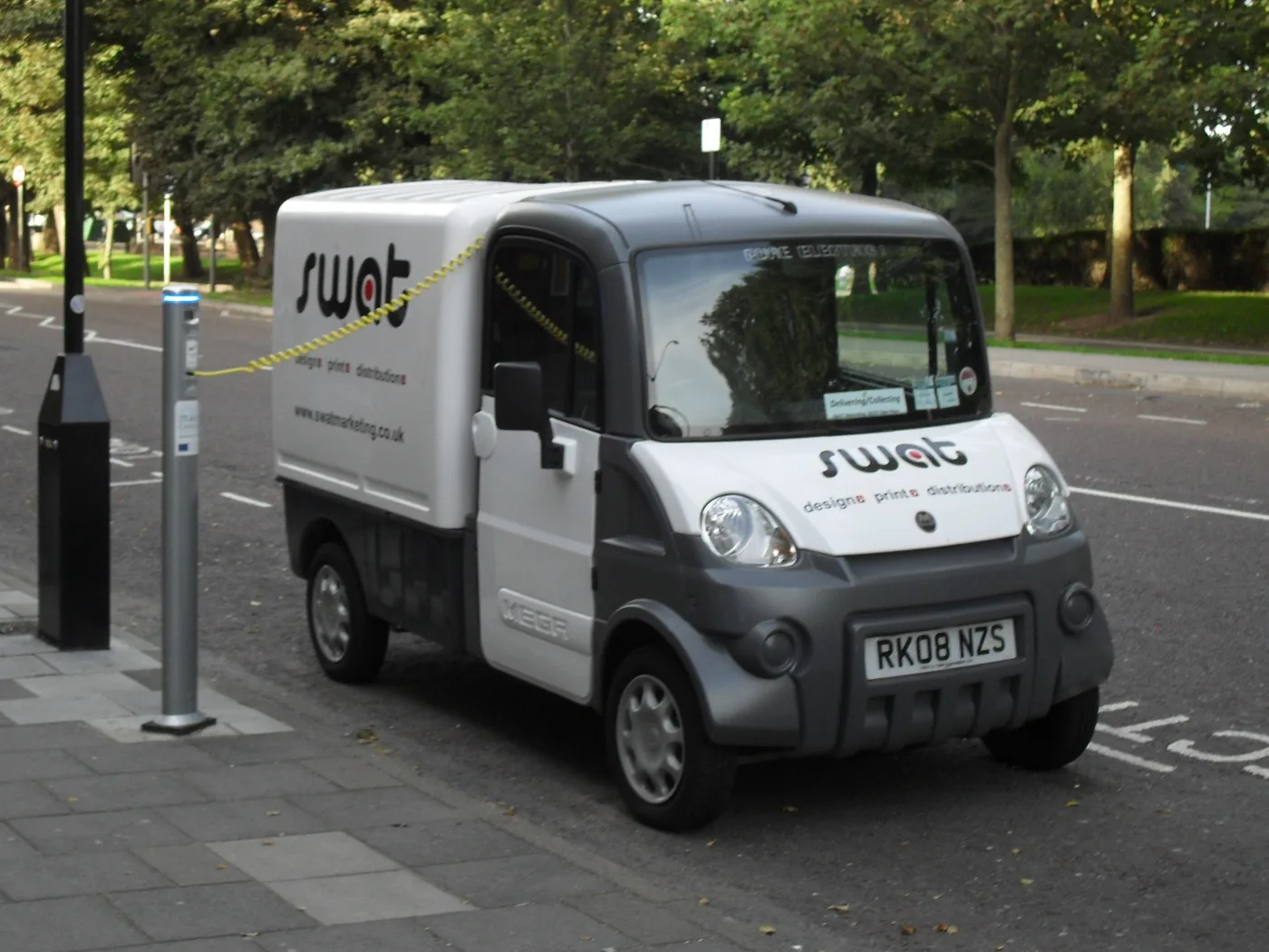 An electric van plugged into an on-street charging point on Ditchling Road, Brighton. The picture shows an older charger, not one of the new Char.gy or Believ units.