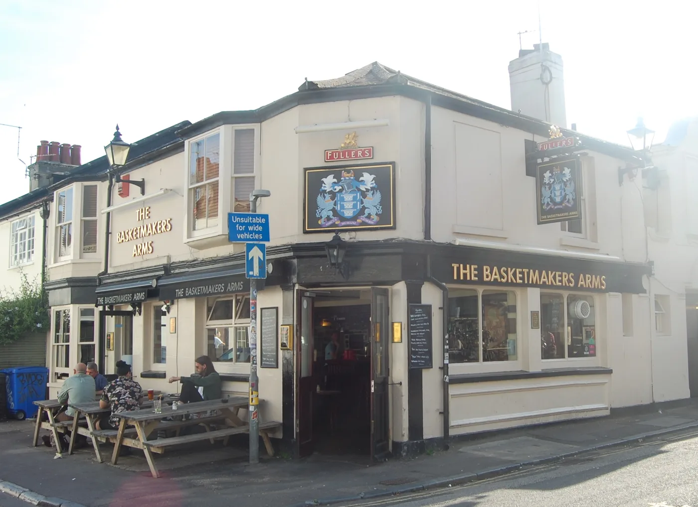 The Basketmakers Arms on the corner of Gloucester Road in North Laine, with drinkers at the benches outside