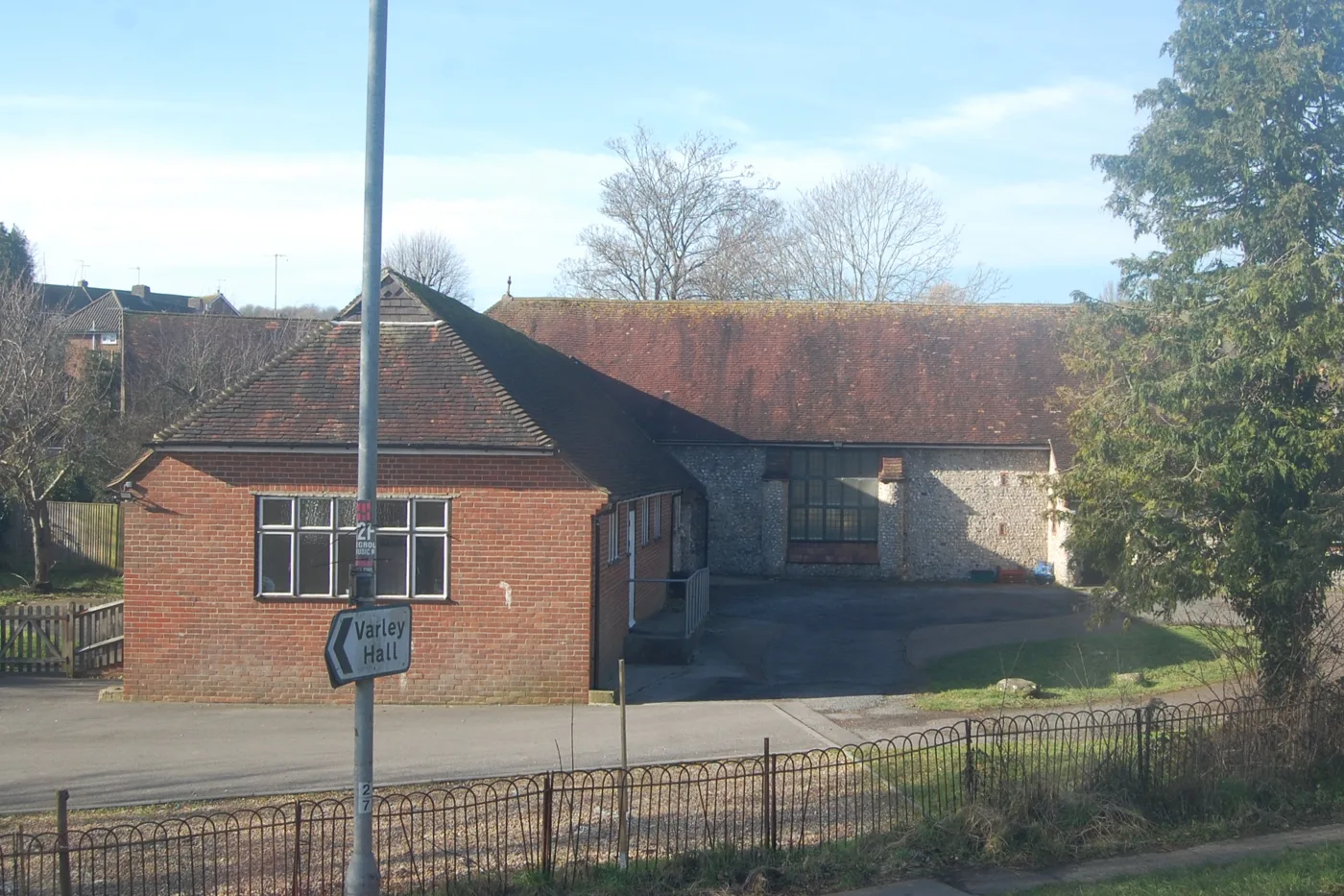St Mary Magdalene's Church on Coldean Lane, with the sign for Varley Hall student accommodation in the foreground. The plan's housing policy is built around the area's student population.