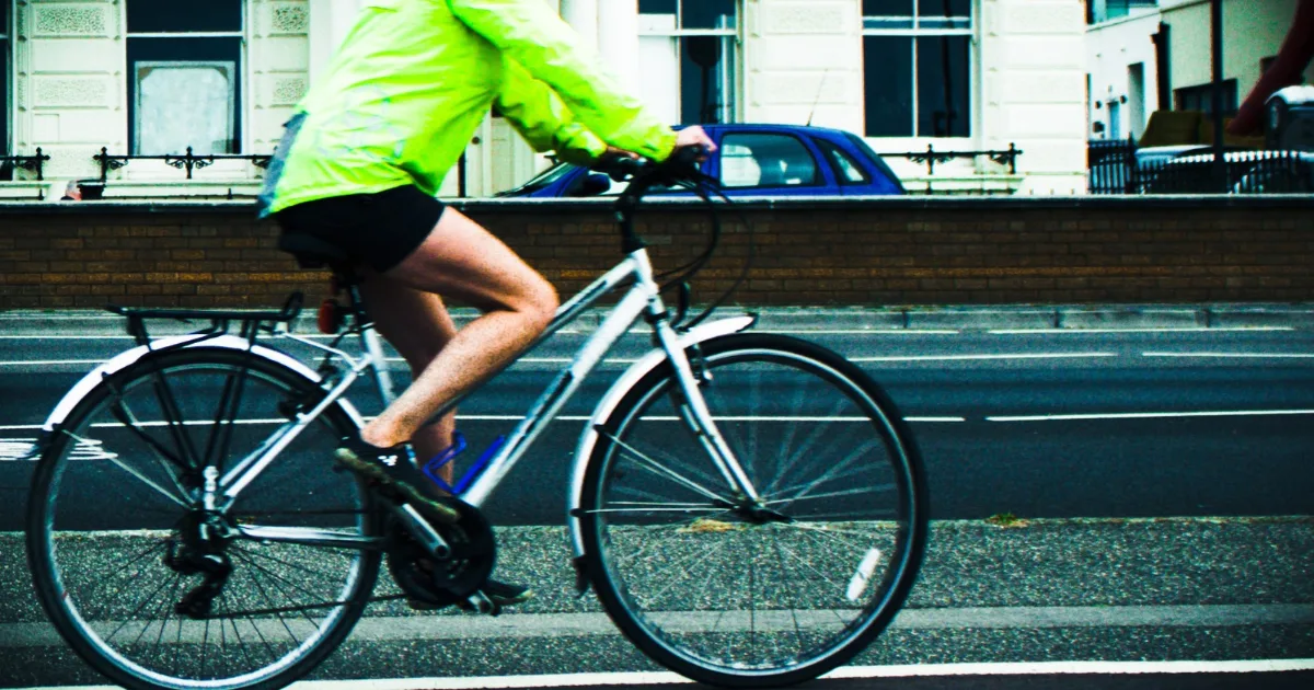 A cyclist in hi-vis on the seafront, from the council's winter road safety campaign.