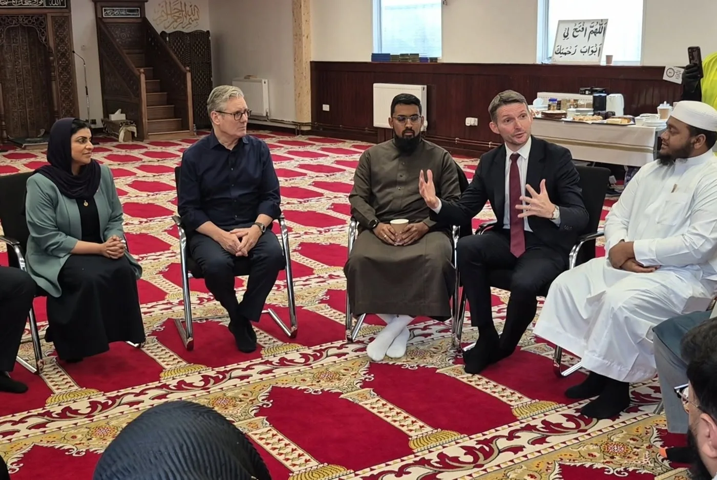 Chris Ward MP, second from right, speaking at a meeting inside Peacehaven mosque